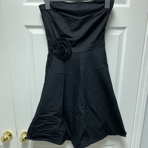 Black Dress with a Statement Flower - Picture 1 of 6